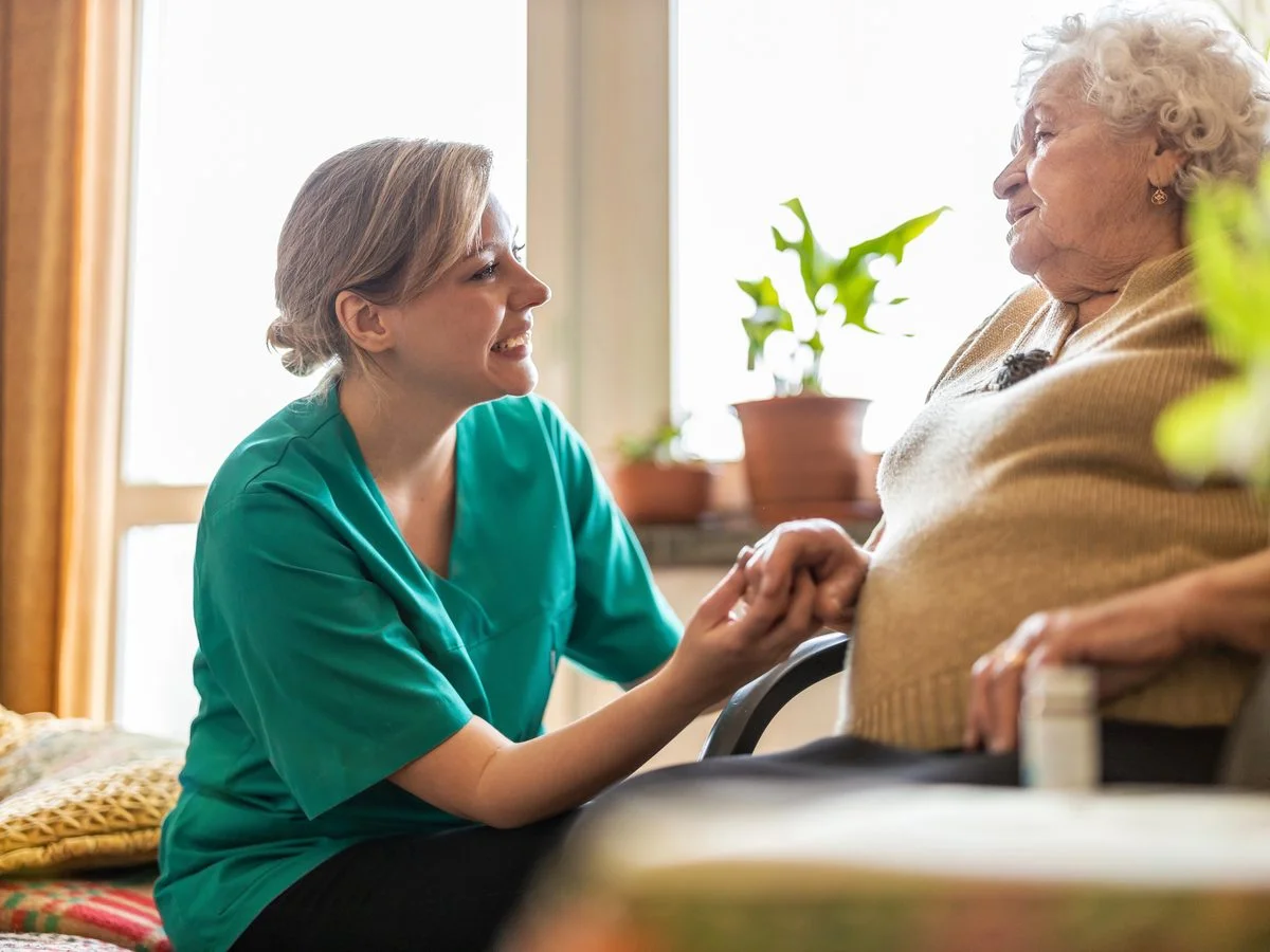 A carer with a patient at home